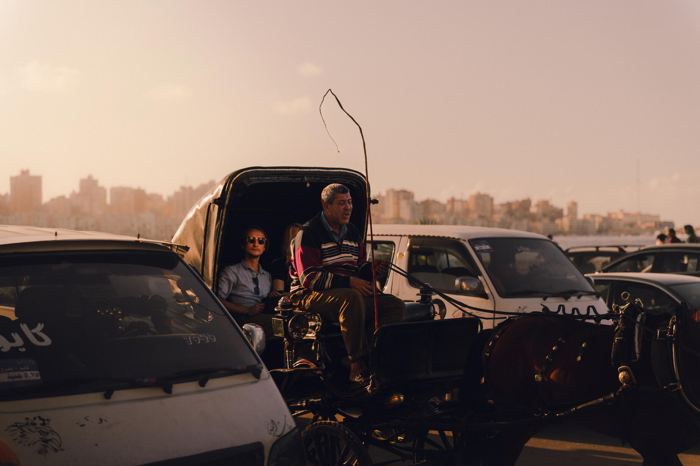 Touring in the cabriolet — In Alexandria, tourists from a different world would come and ride with the cabriolet driver, who is probably on the other spectrum of the economic cycle.