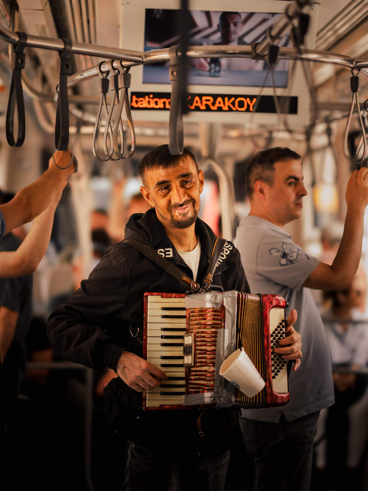 Being an artist — a man playing music for tips on a tram in Istanbul. Despite having vitiligo, he had a strong reason to put himself out there not caring much about people's looks.