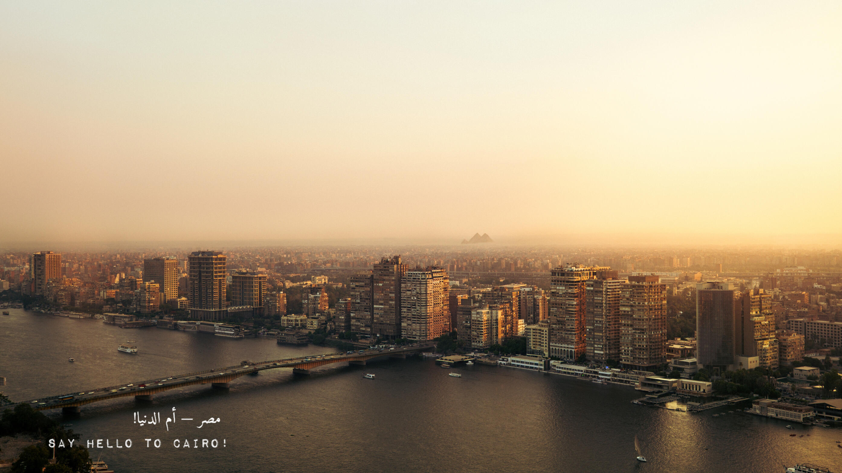 Cairo & The Pyramids - A wide look on Cairo from one of the highest roof tops that showcases the magic of Cairo and its extension to Giza, where the Pyramids are.