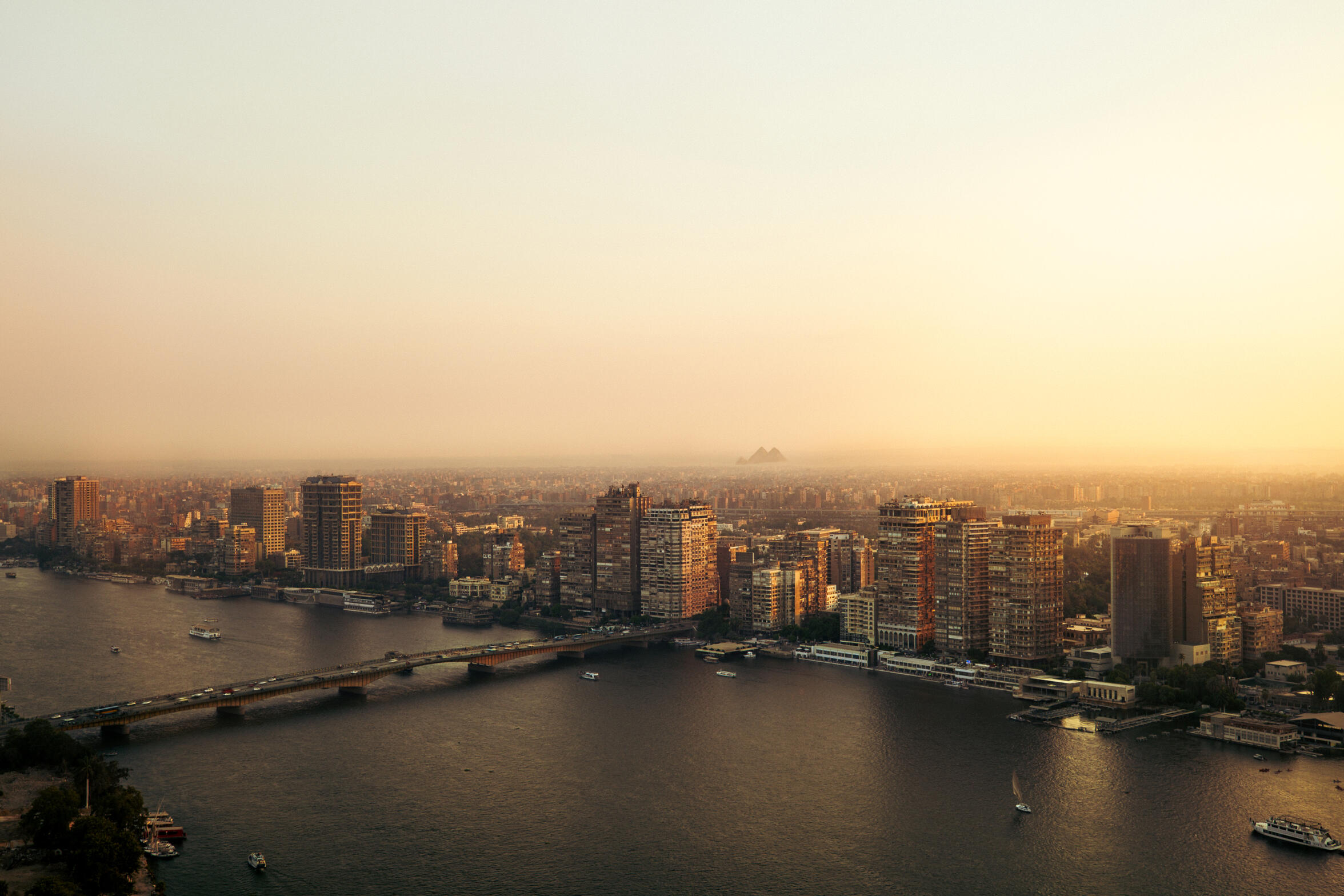 The Pyramids and Cairo — A wide look at Cairo from one of the highest rooftops that showcases the magic of the Egyptian capital and its extension to Giza, where the Pyramids are.
