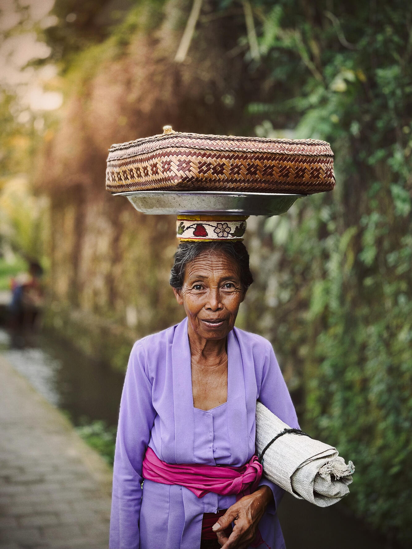 The Rice-field woman — In early mornings, I'd encounter people who work in the rice fields, right next to their homes. Peaceful and very positive people. You'd witness the power in their skin and the bright eyes.