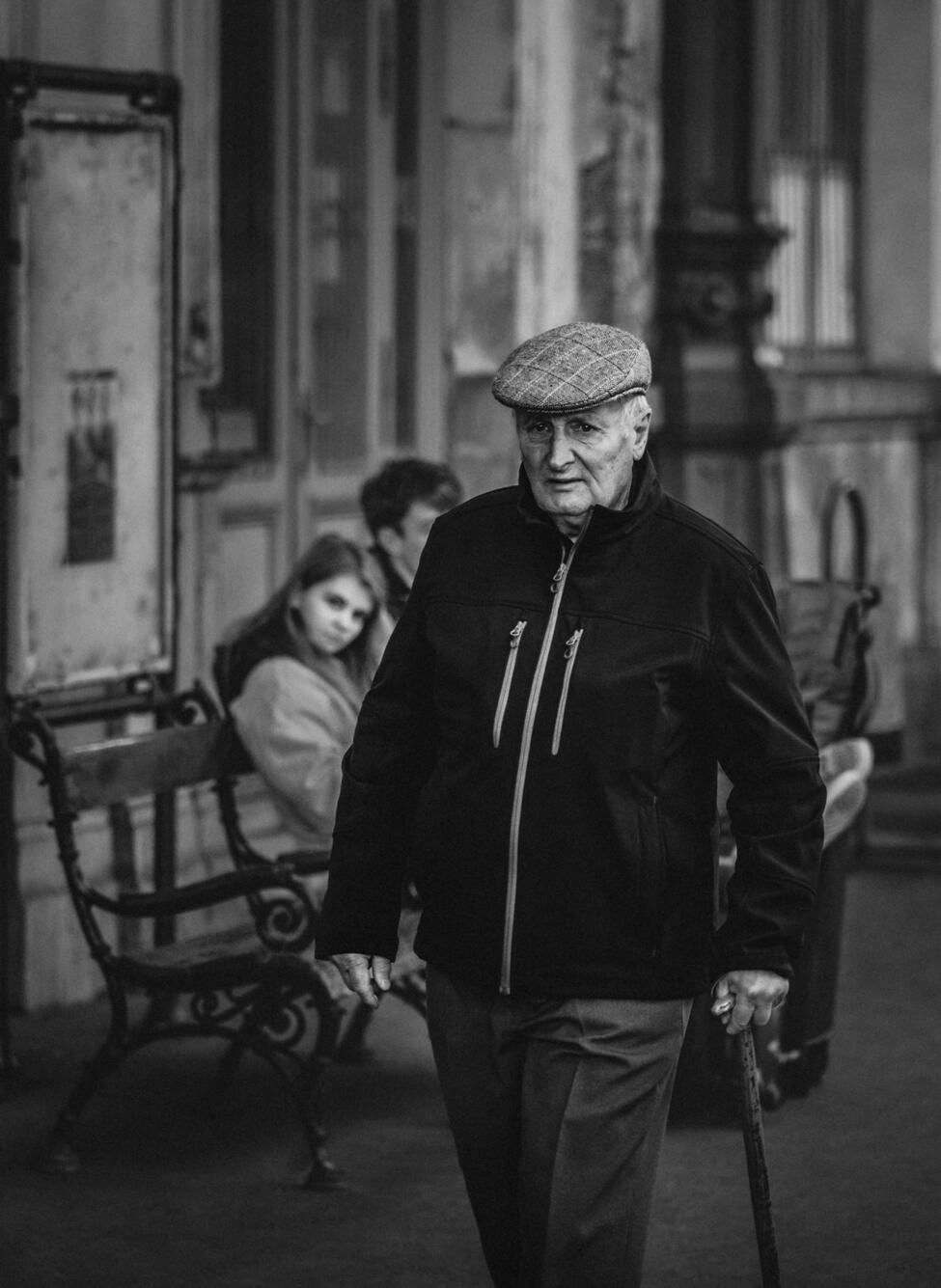 This elderly man embodied a phase in the lives of countless individuals. In that moment, with his candid expression, it seemed as though he was burdened with a significant amount of baggage.